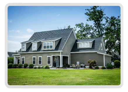 A newly remodeled custom home with a charming sage green cement siding and 25-year roof shows off an exterior that will make any homeowner proud.