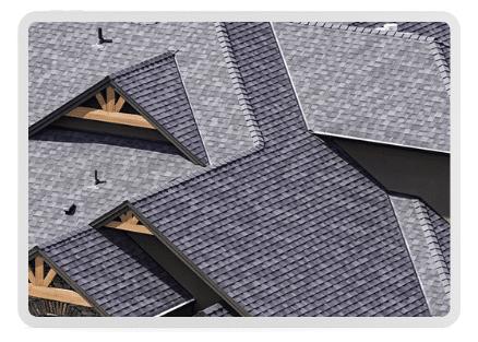 Brand new luxury roof featuring high-end black and gray shingles on a large estate-style home. The complex roof design showcases expert craftsmanship and premium materials, ensuring durability and long-lasting protection.