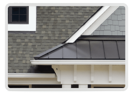 Brand new siding, asphalt shingles and a metal roof all converge in an elegant and modern home's exterior above a covered porch to the entryway.