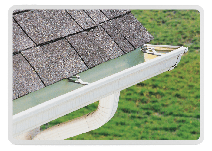 White, aluminum gutters line the edge of a 2nd story home with a new replacement completed by custom home remodeling company, Dexteriors.