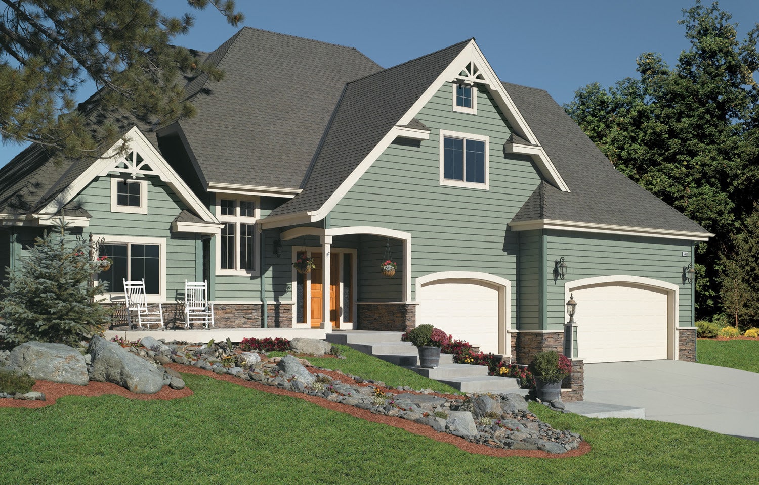 Modern sage-colored siding on a beautiful home